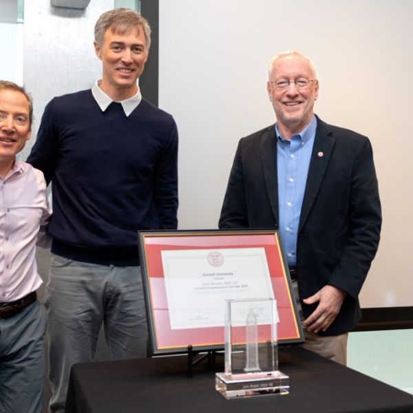 Jason Koski/Cornell University  John Bicket ’02, center, receives the Cornell Entrepreneur of the Year award from Zach Shulman ’87, J.D. ‘90, director of Entrepreneurship at Cornell, left, and Cornell President Michael Kotlikoff.