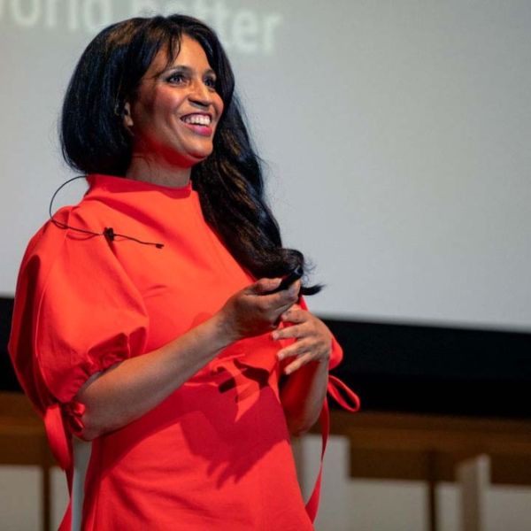 Woman speaks on stage