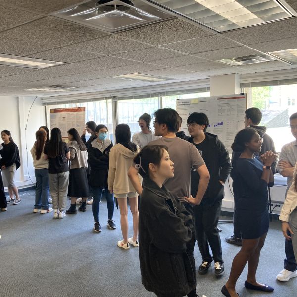 A color photo showing a group of people at a recent MPS poster session