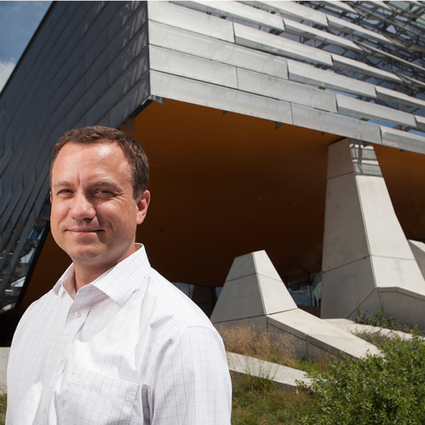 photo of Dean Morrisett in front of Gates