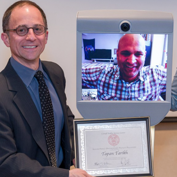 photo of Tapan Parikh getting award via Beam