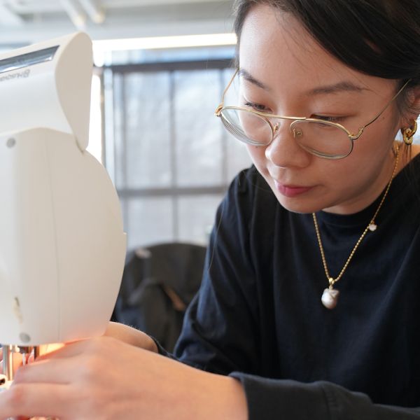 Louis DiPietro/Provided Catherine Yu creates smart clothing by sewing conductive threads into the seams of a normal T-shirt in the Sci-Fi Lab.