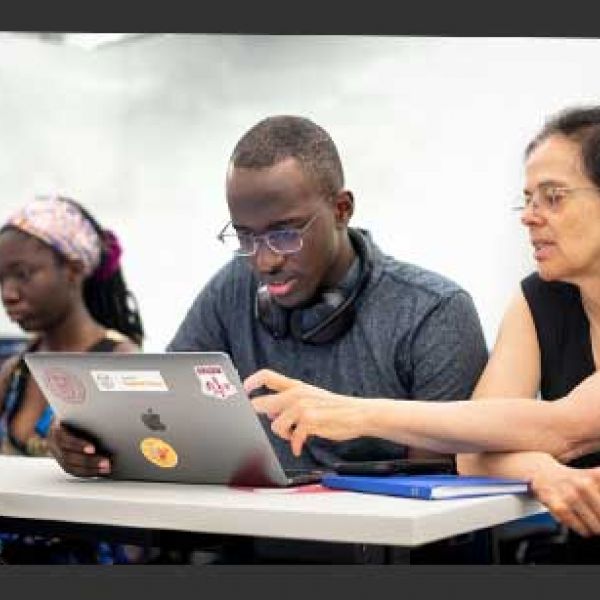 Éva Tardos, the Jacob Gould Schurman Professor of Computer Science, works with students during the 2021 CSMore class in Gates Hall.