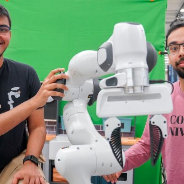 Louis DiPietro/Provided Kushal Kedia (left), a doctoral student in the field of computer science, and Prithwish Dan, M.S. ’26, are members of the development team behind RHyME, a system that allows robots to learn tasks by watching a single how-to video.
