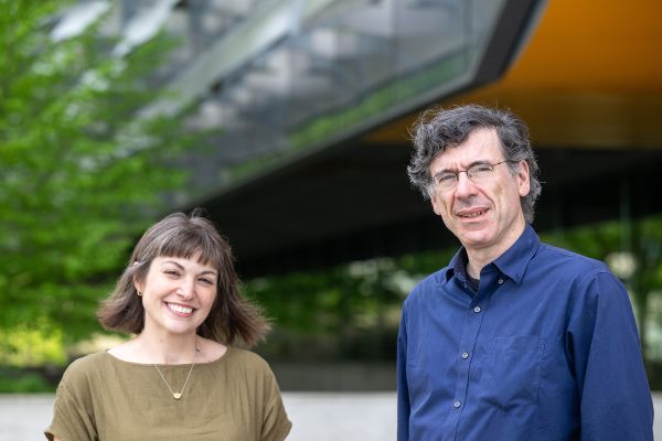 Jon Kleinberg and Karen Levy A color photo showing a man and woman standing outside of Gates Hall