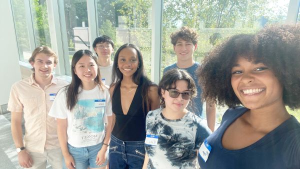 Caption: A group of CSMore participants gather for a quick photo during orientation. Credit: Provided A color photo showing a group of people smiling for a photo
