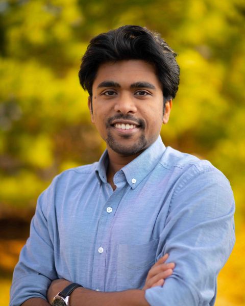 Saikat Dutta A color photo of a man smiling for a photo