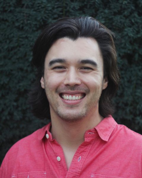 Michael Kim A color photo of a man smiling for a photo