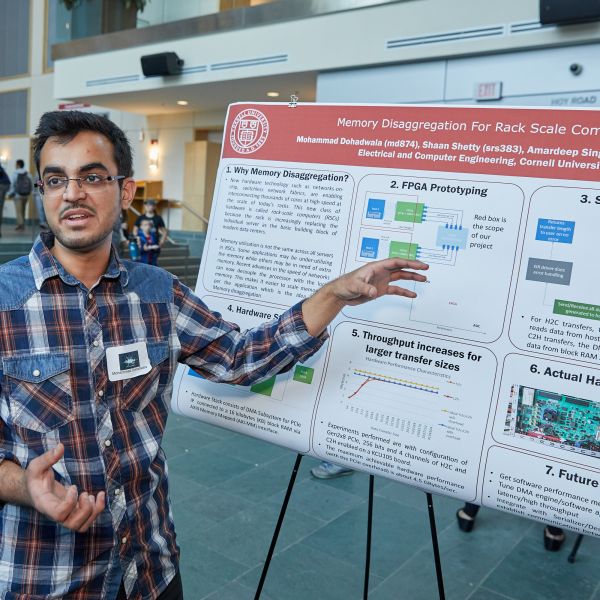 student presenting poster at BOOM