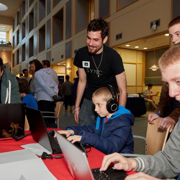 students exploring exhibits at BOOM