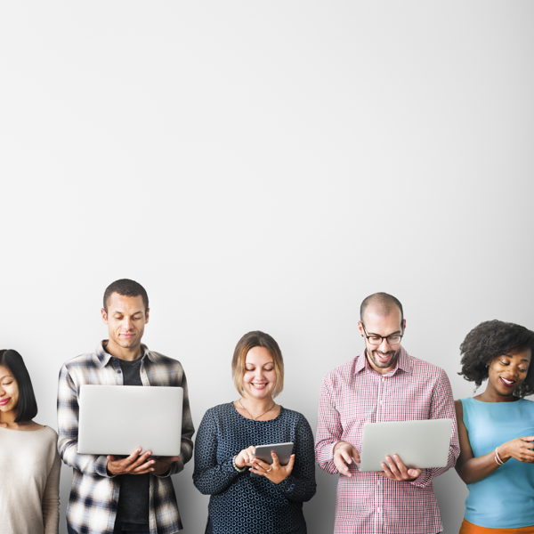 A color photo showing people using electronic devices