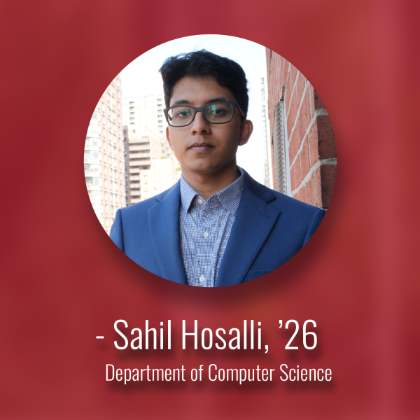 A color photo of a man smiling for a photo with a red background