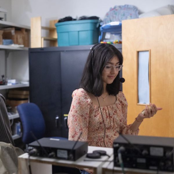 Credit: Chris Kitchen Caption: Sneah Singhi ’26, works in the observation room at the B.A.B.Y Lab, which studies infant language acquisition.